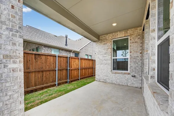 a view of a house with a garage and yard