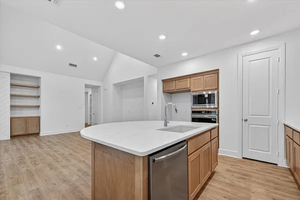 a kitchen with a sink and cabinets