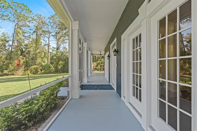 a bedroom with a bed window and wooden floor