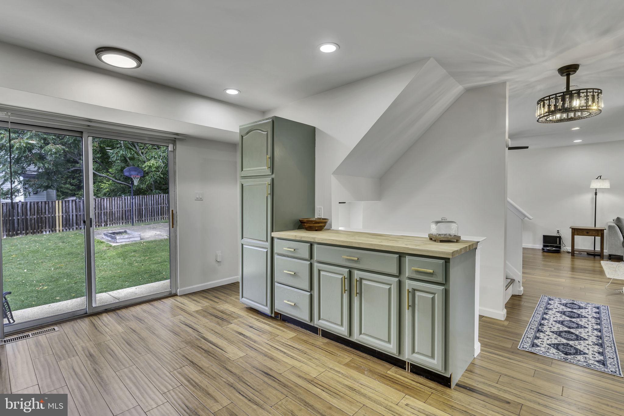 6546 Cornell Road Bryans Road, MD 20616 - Photo 12 of 35 a kitchen with a sink and wooden floor