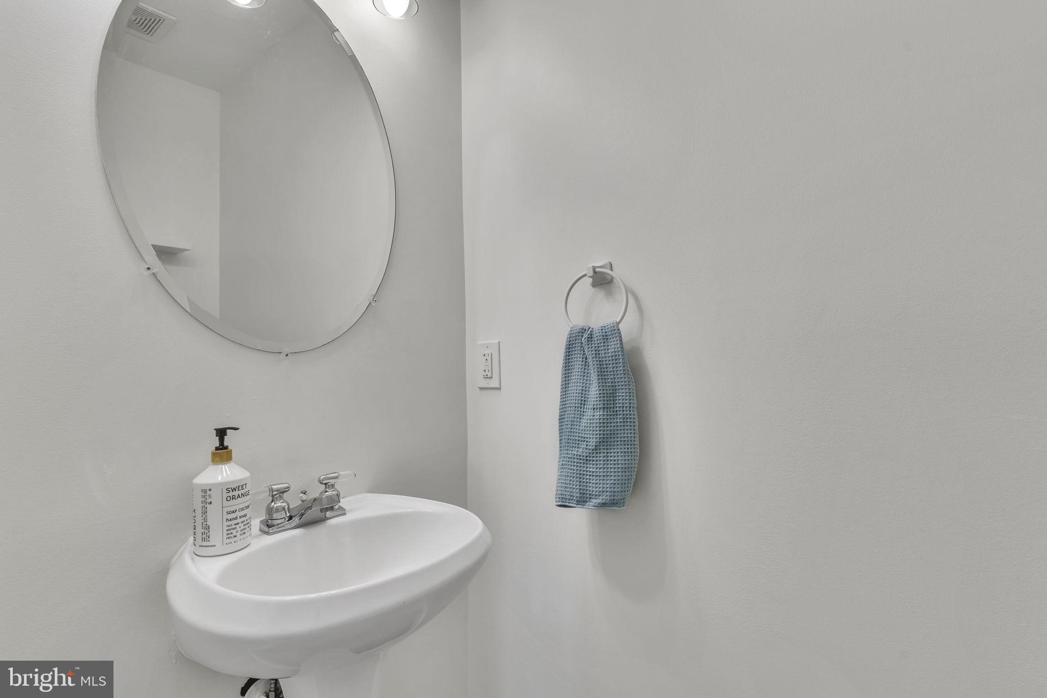6546 Cornell Road Bryans Road, MD 20616 - Photo 16 of 35 a bathroom with a sink and a mirror
