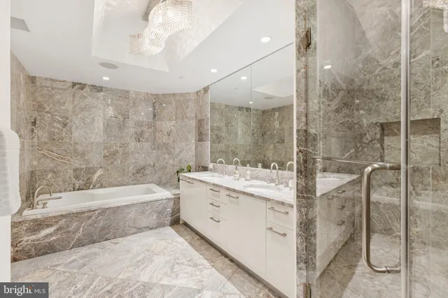 a bedroom with a bed and a large window with outer view