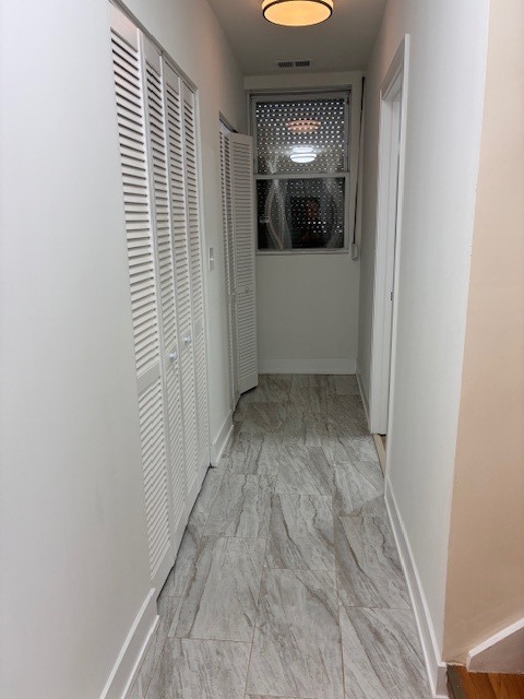 8010 South Ridgeland Avenue, Unit 1D Chicago, IL 60617 - Photo 17 of 28 a view of empty room with window