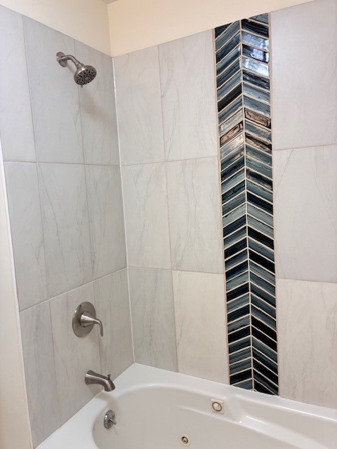 8010 South Ridgeland Avenue, Unit 1D Chicago, IL 60617 - Photo 23 of 28 a bathroom with a bathtub and a shower