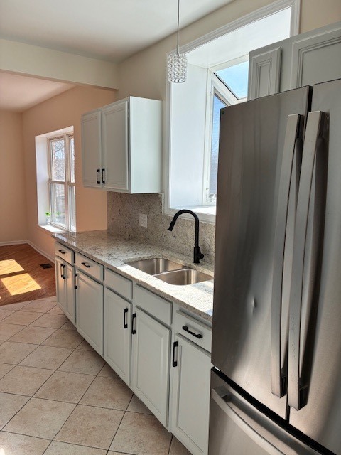 8010 South Ridgeland Avenue, Unit 1D Chicago, IL 60617 - Photo 6 of 28 a kitchen with stainless steel appliances granite countertop a refrigerator and a sink