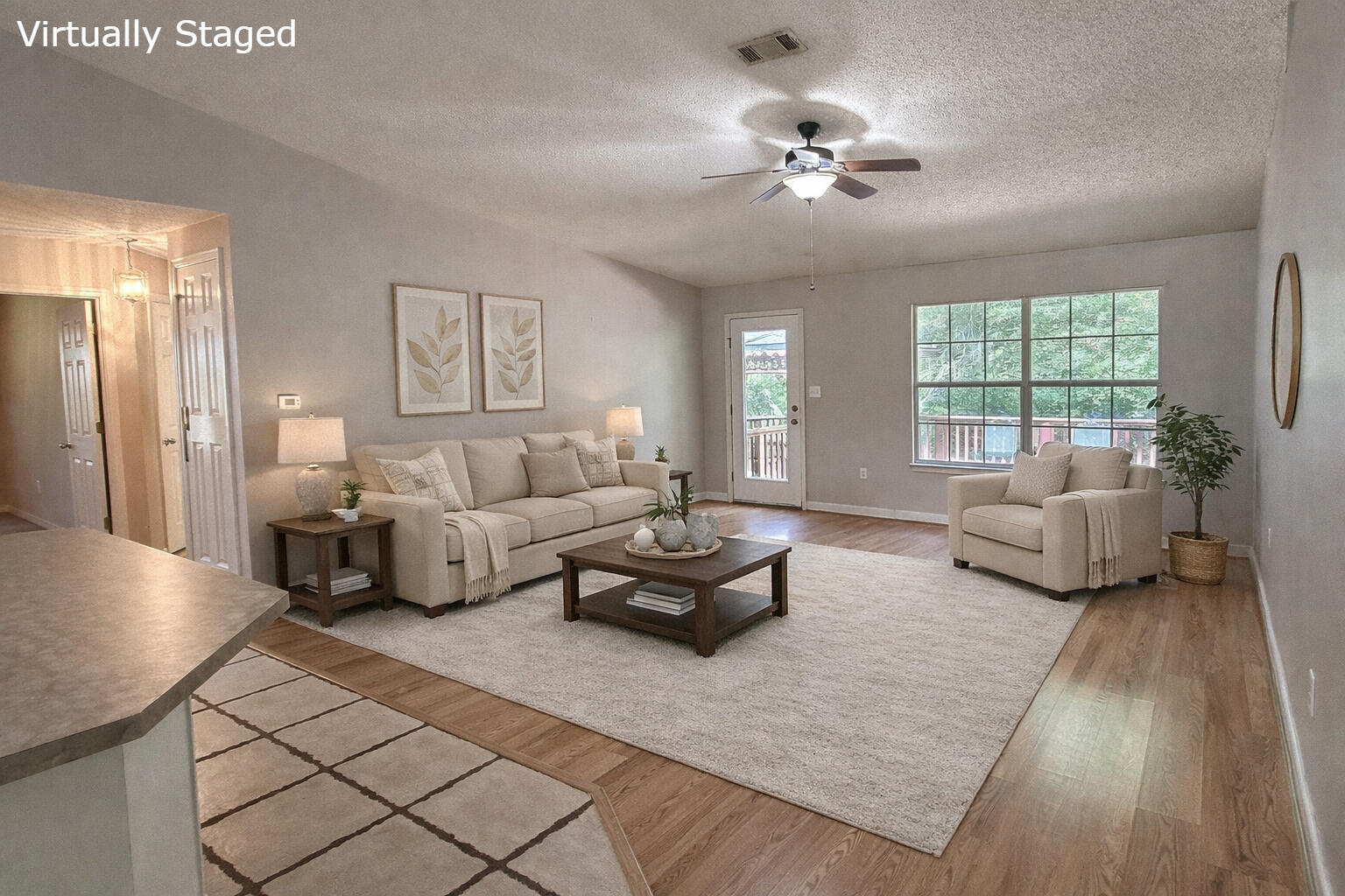 4868 Orlimar Street Crestview, FL 32536 - Photo 13 of 25 a living room with furniture and a chandelier