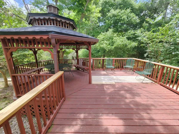 a view of a roof deck with wooden floor