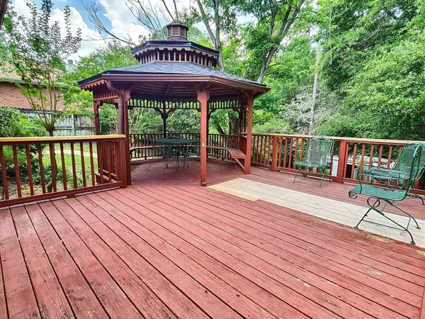 a view of deck with wooden floor and outdoor seating