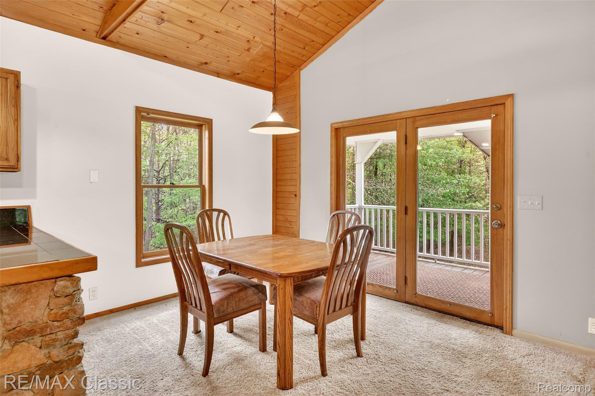 4611 Murray Road Mayville, MI 48744 - Photo 33 of 50 Dining room with abundant natural light and doorwall leading to wrap-around deck