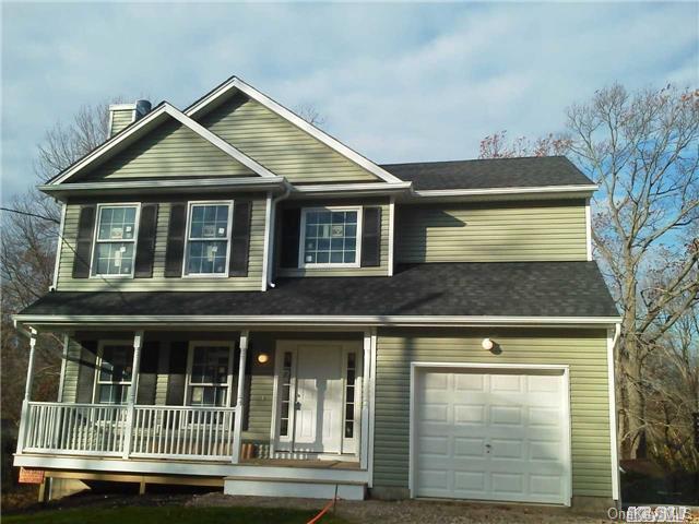 a front view of a house with a garage