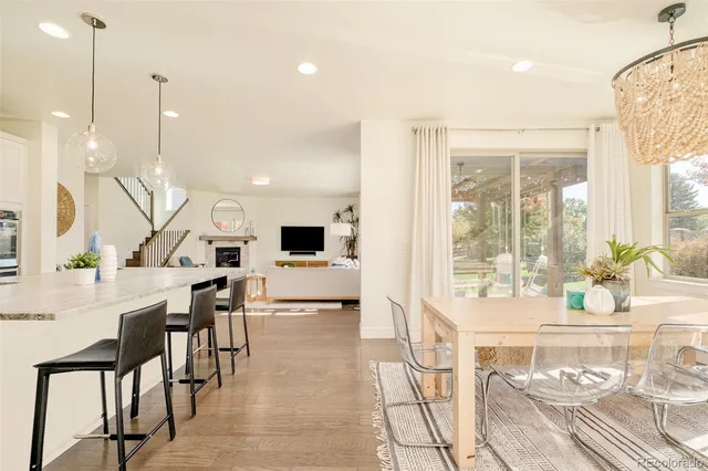 a very nice looking living room with a large window and furniture