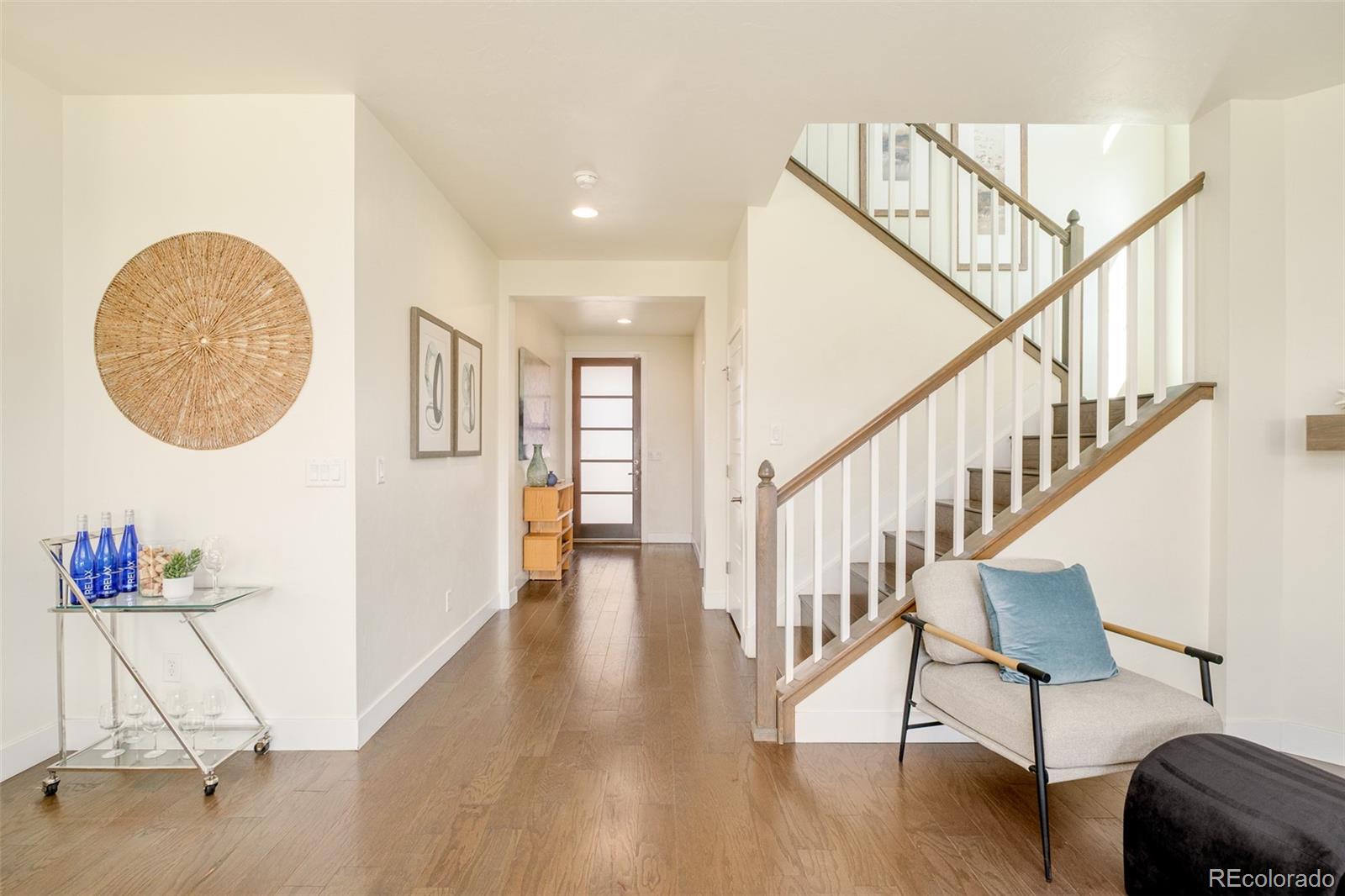 11880 West 38th Place Wheat Ridge, CO 80033 - Photo 15 of 30 a view of entryway and hall with wooden floor