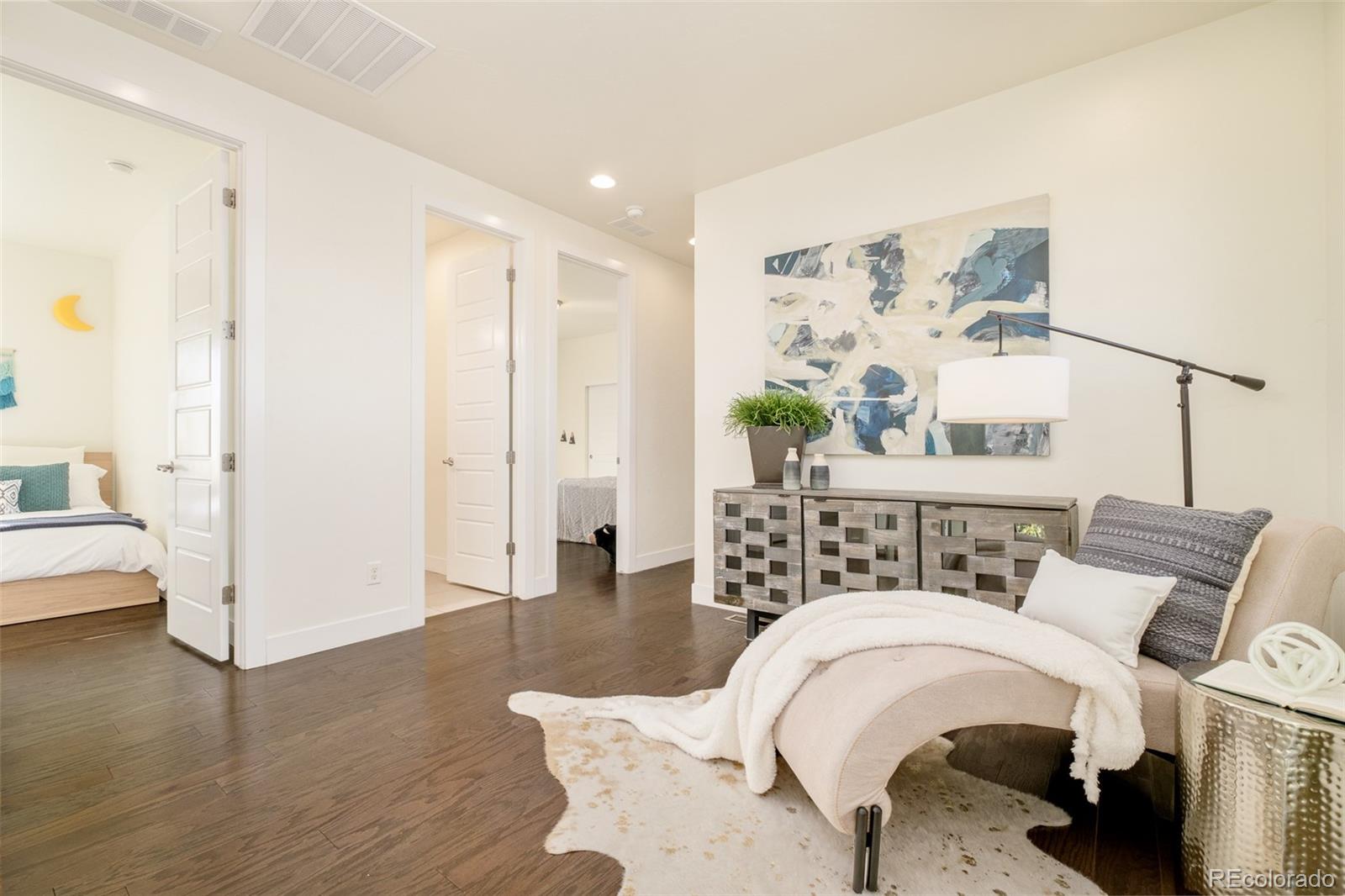 11880 West 38th Place Wheat Ridge, CO 80033 - Photo 18 of 30 a living room with furniture and wooden floor