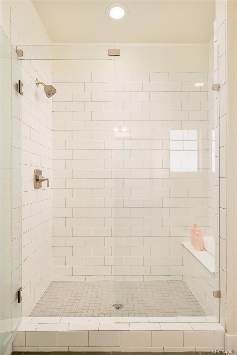 11880 West 38th Place Wheat Ridge, CO 80033 - Photo 21 of 30 a bathroom with a shower