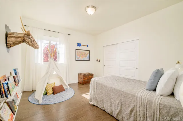 a bedroom with a bed and a couch