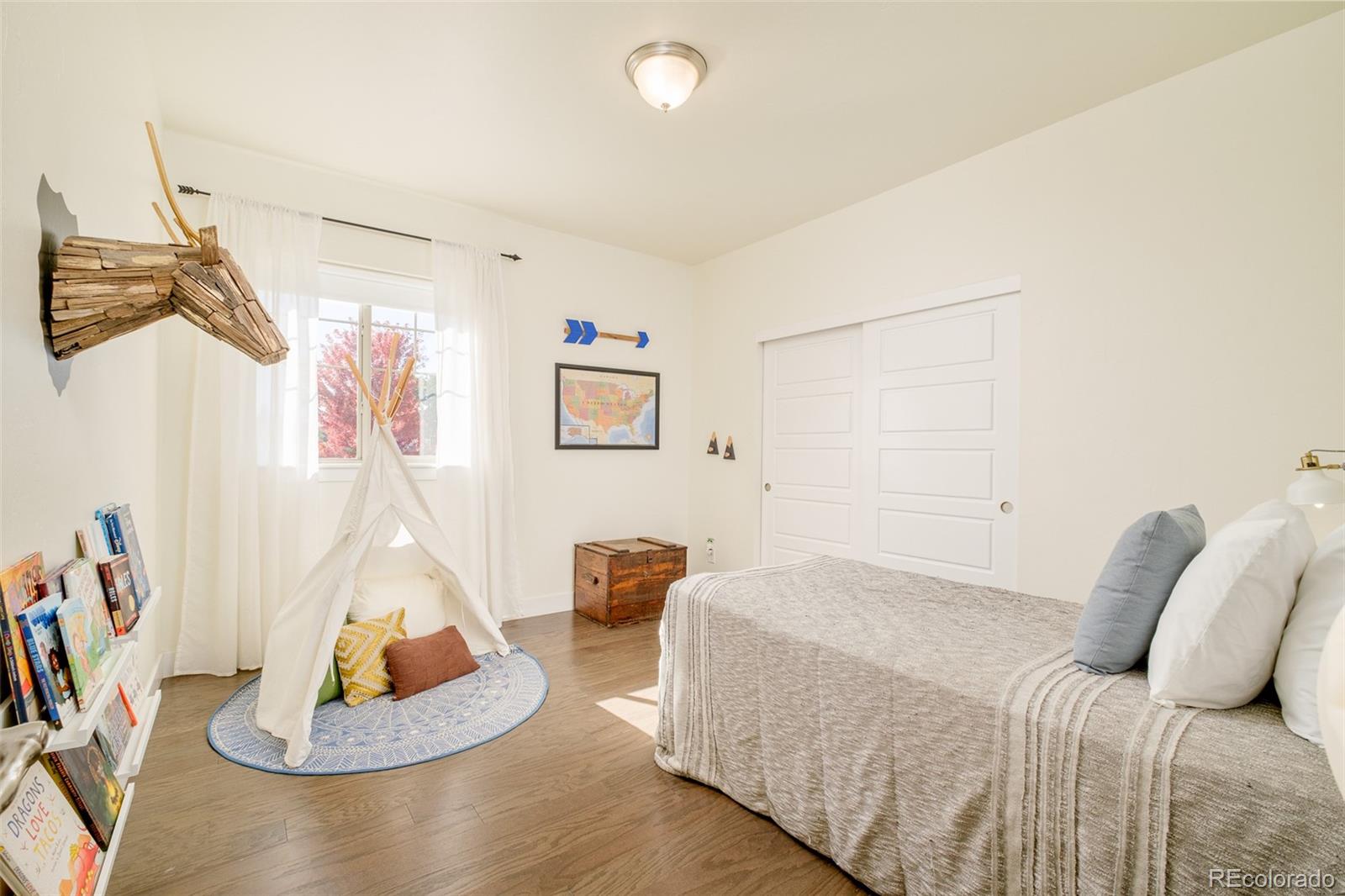 11880 West 38th Place Wheat Ridge, CO 80033 - Photo 24 of 30 a bedroom with a bed and a couch