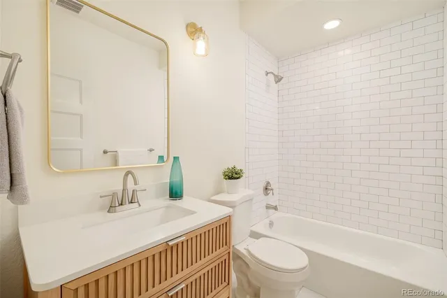 a view of a porch with furniture and floor to ceiling window