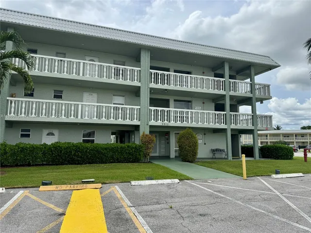 a view of house with outdoor space and swimming pool