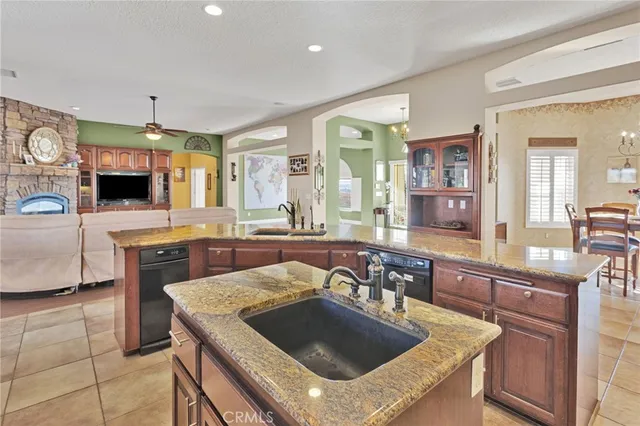 a kitchen with a stove a sink and a refrigerator