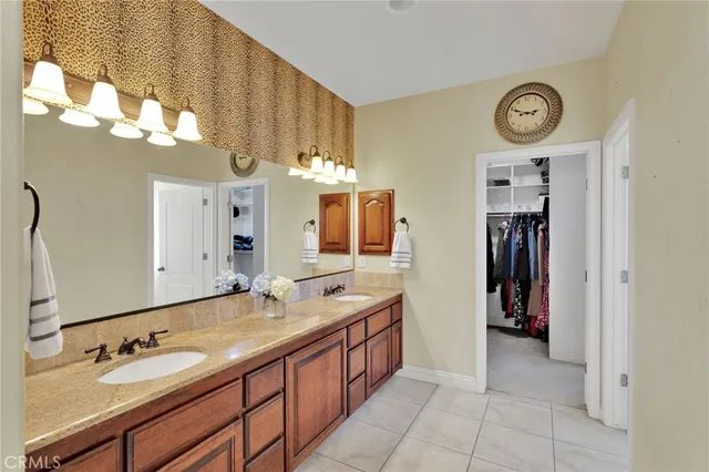 a bathroom with a sink a vanity and a mirror