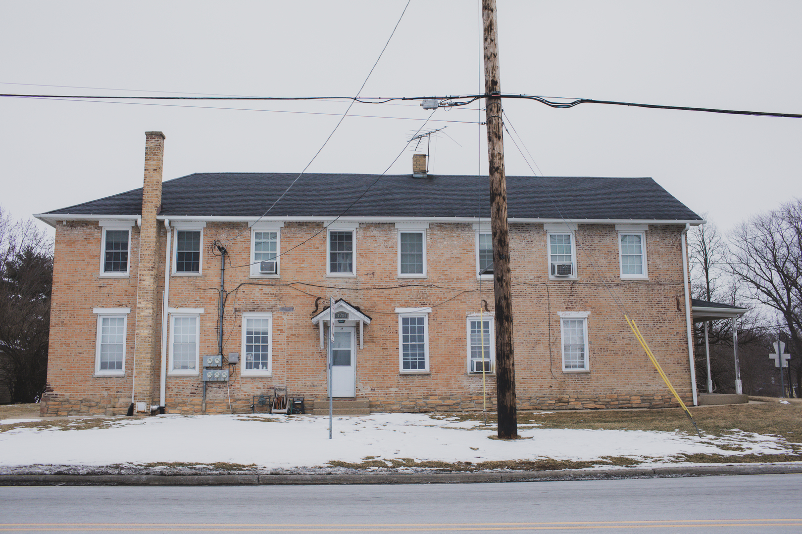 a front view of a house with street