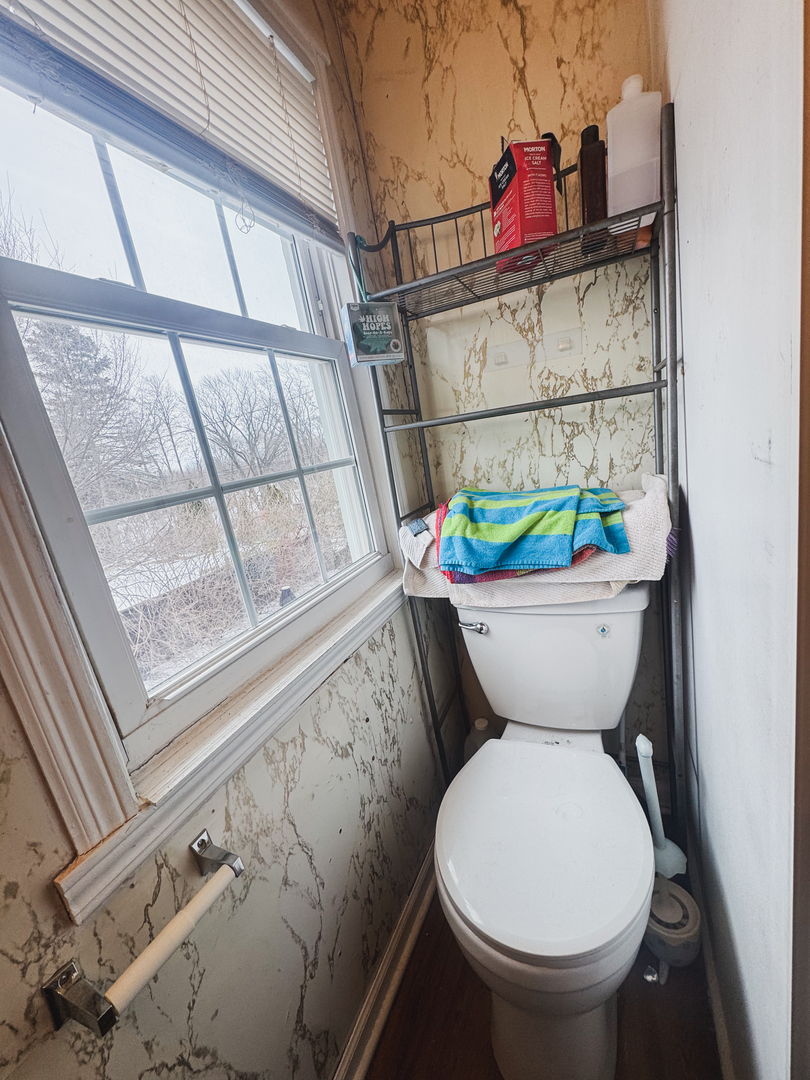 3701 Spring Grove Road Johnsburg, IL 60051 - Photo 22 of 46 a bathroom with a toilet sink and mirror