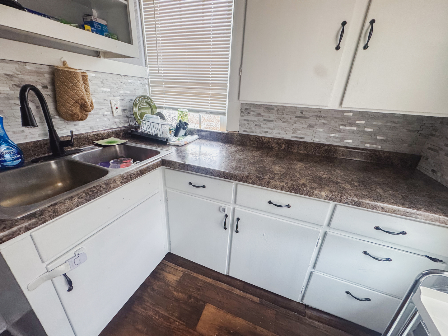 3701 Spring Grove Road Johnsburg, IL 60051 - Photo 35 of 46 a kitchen with granite countertop white cabinets and a sink