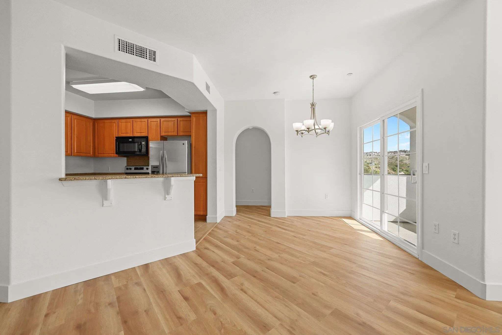 2708 Lake Pointe Drive, Unit 209 Spring Valley, CA 91977 - Photo 14 of 59 a view of a kitchen with a sink and a window