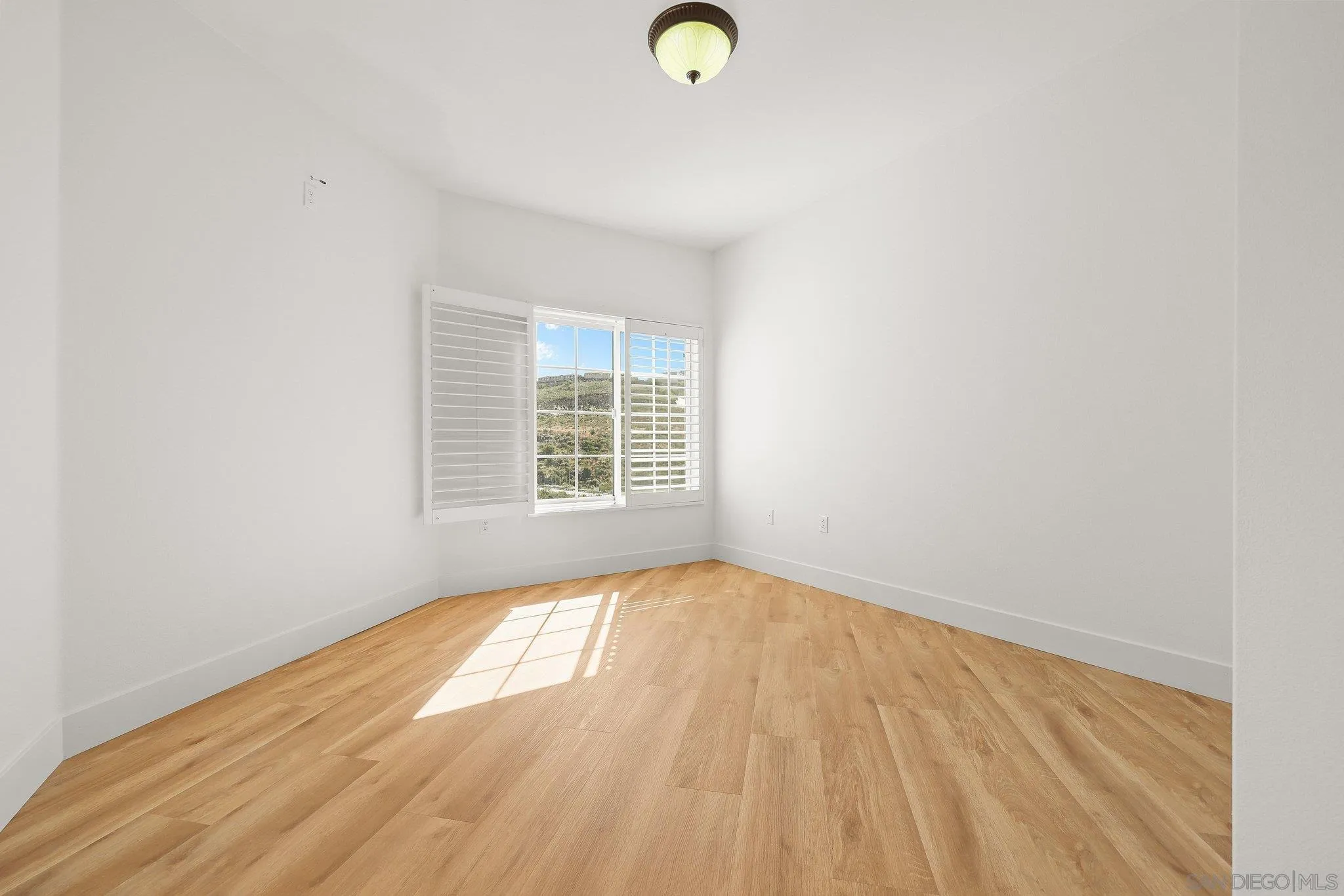 2708 Lake Pointe Drive, Unit 209 Spring Valley, CA 91977 - Photo 19 of 59 a view of a room with wooden floor and window