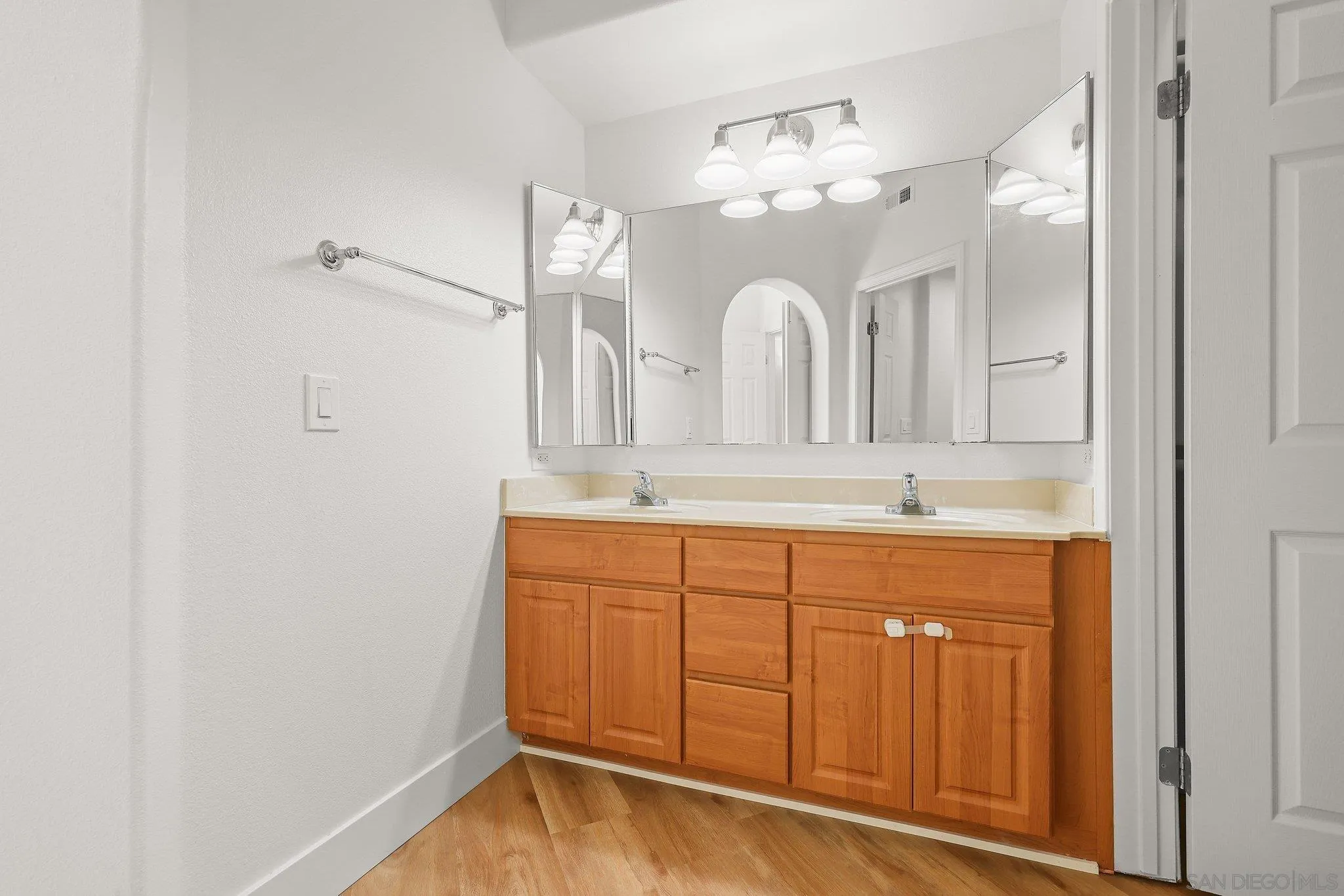 2708 Lake Pointe Drive, Unit 209 Spring Valley, CA 91977 - Photo 21 of 59 a bathroom with a double vanity sink and a mirror