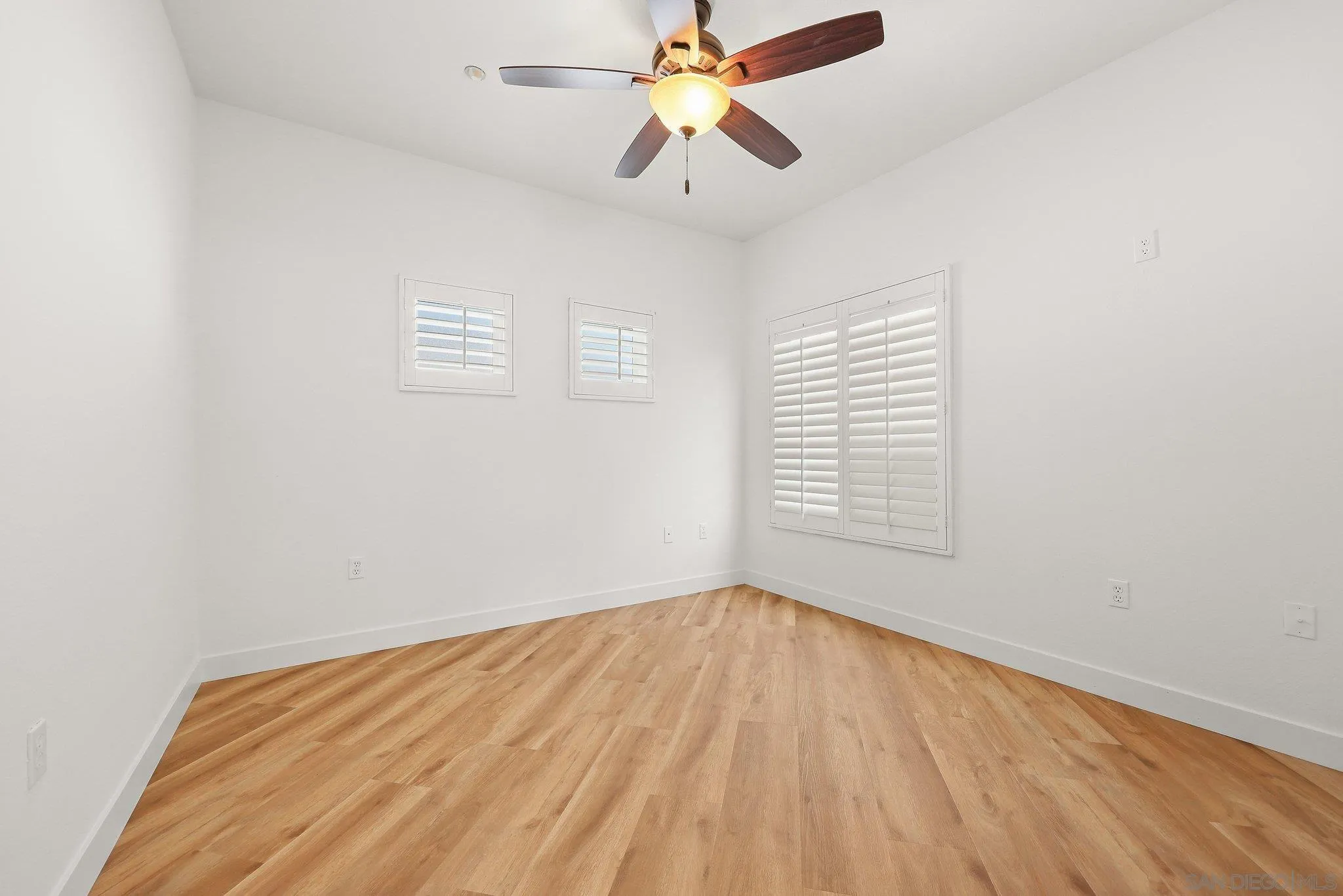 2708 Lake Pointe Drive, Unit 209 Spring Valley, CA 91977 - Photo 22 of 59 a view of empty room with wooden floor and fan