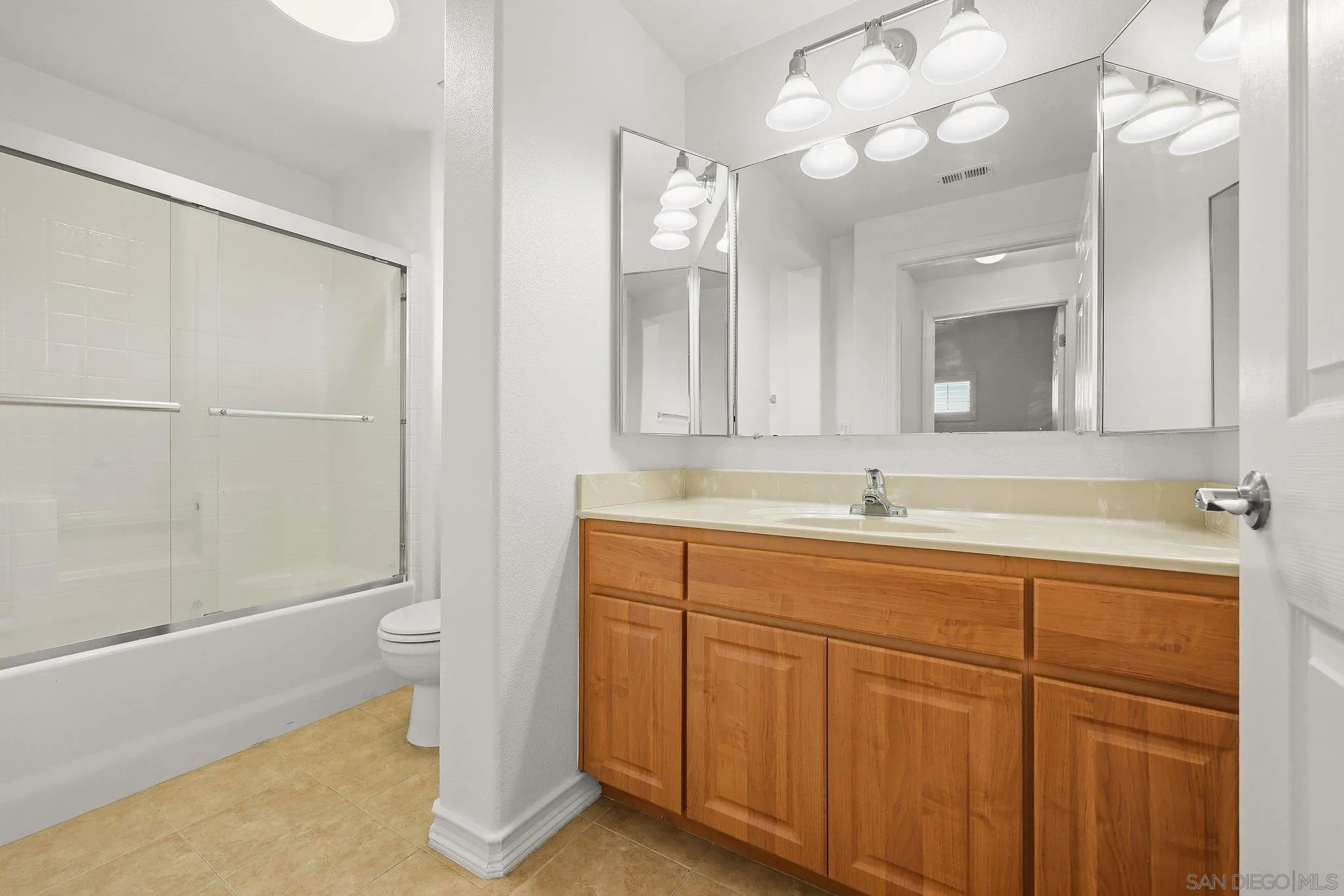 2708 Lake Pointe Drive, Unit 209 Spring Valley, CA 91977 - Photo 24 of 59 a bathroom with a sink a toilet and a mirror