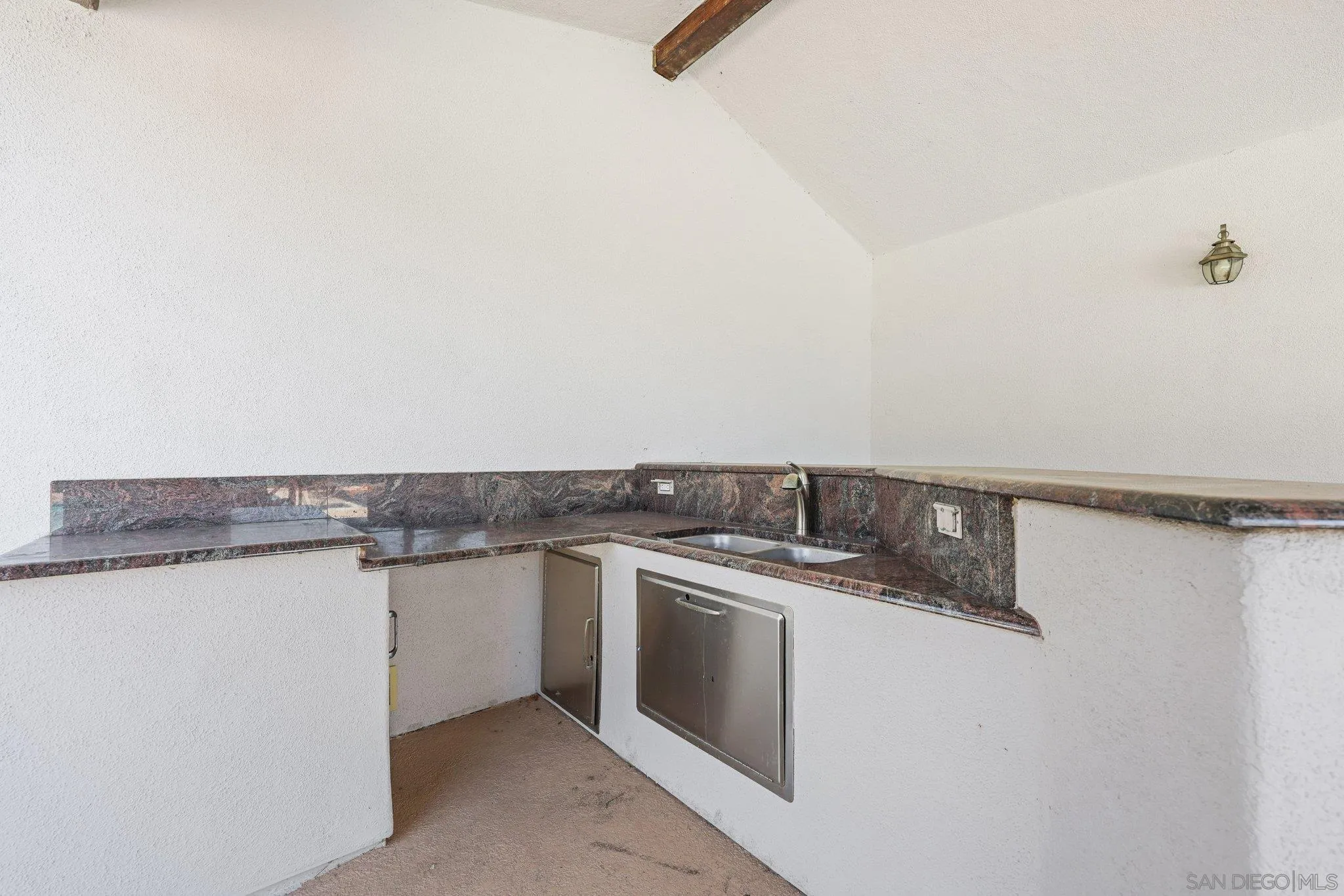 2708 Lake Pointe Drive, Unit 209 Spring Valley, CA 91977 - Photo 29 of 59 a utility room with stainless steel appliances granite countertop a sink and cabinets
