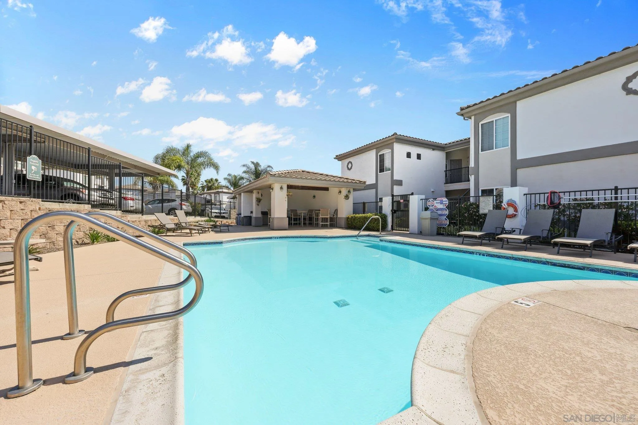 2708 Lake Pointe Drive, Unit 209 Spring Valley, CA 91977 - Photo 30 of 59 a swimming pool with outdoor seating and yard