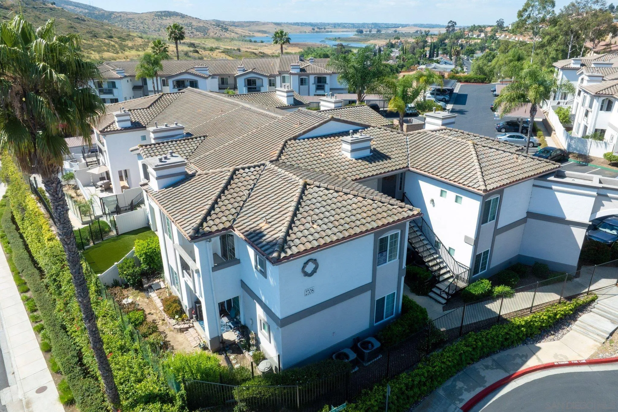 2708 Lake Pointe Drive, Unit 209 Spring Valley, CA 91977 - Photo 47 of 59 an aerial view of multiple houses with yard