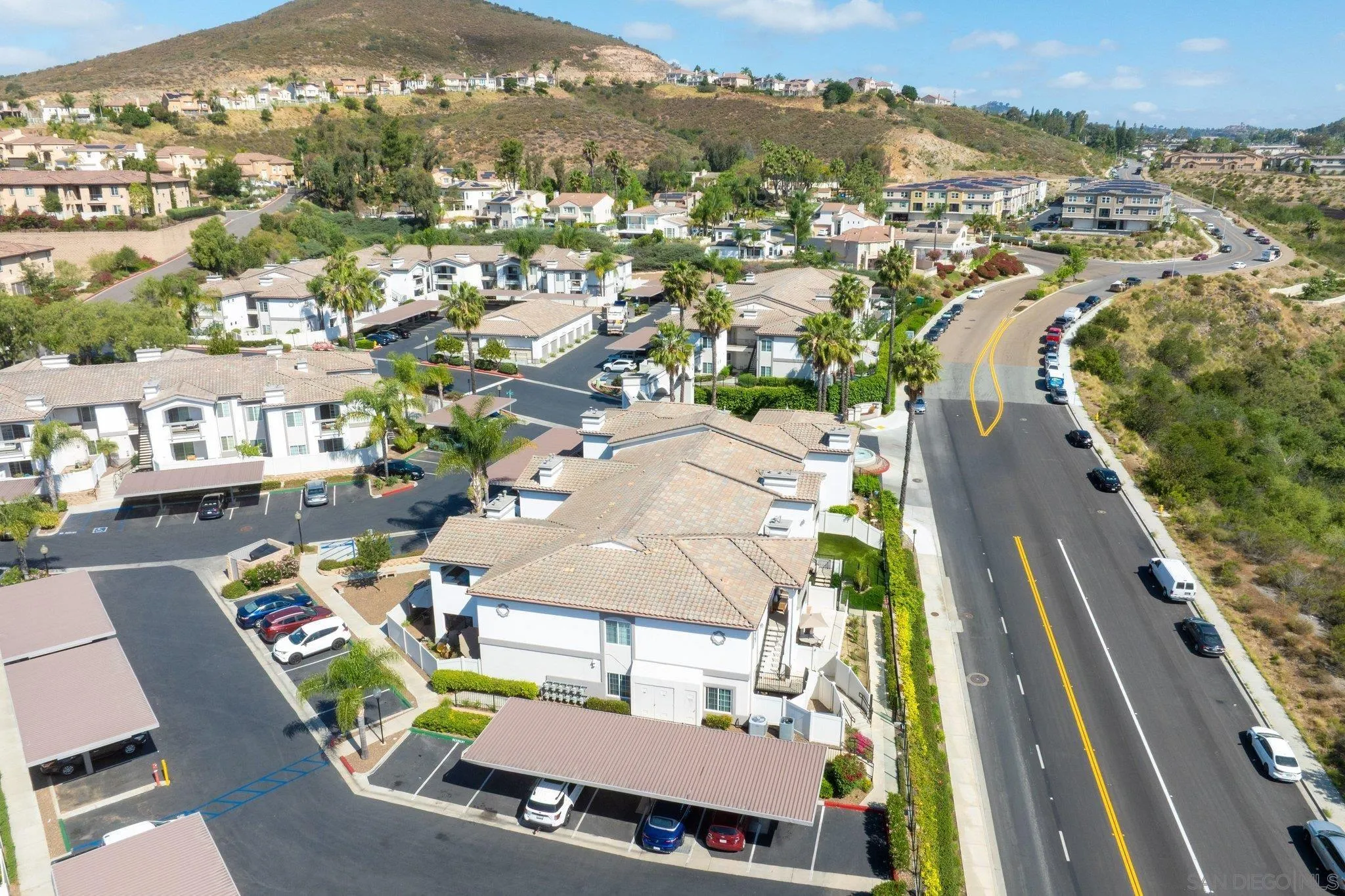 2708 Lake Pointe Drive, Unit 209 Spring Valley, CA 91977 - Photo 54 of 59 an aerial view of residential houses with outdoor space and parking