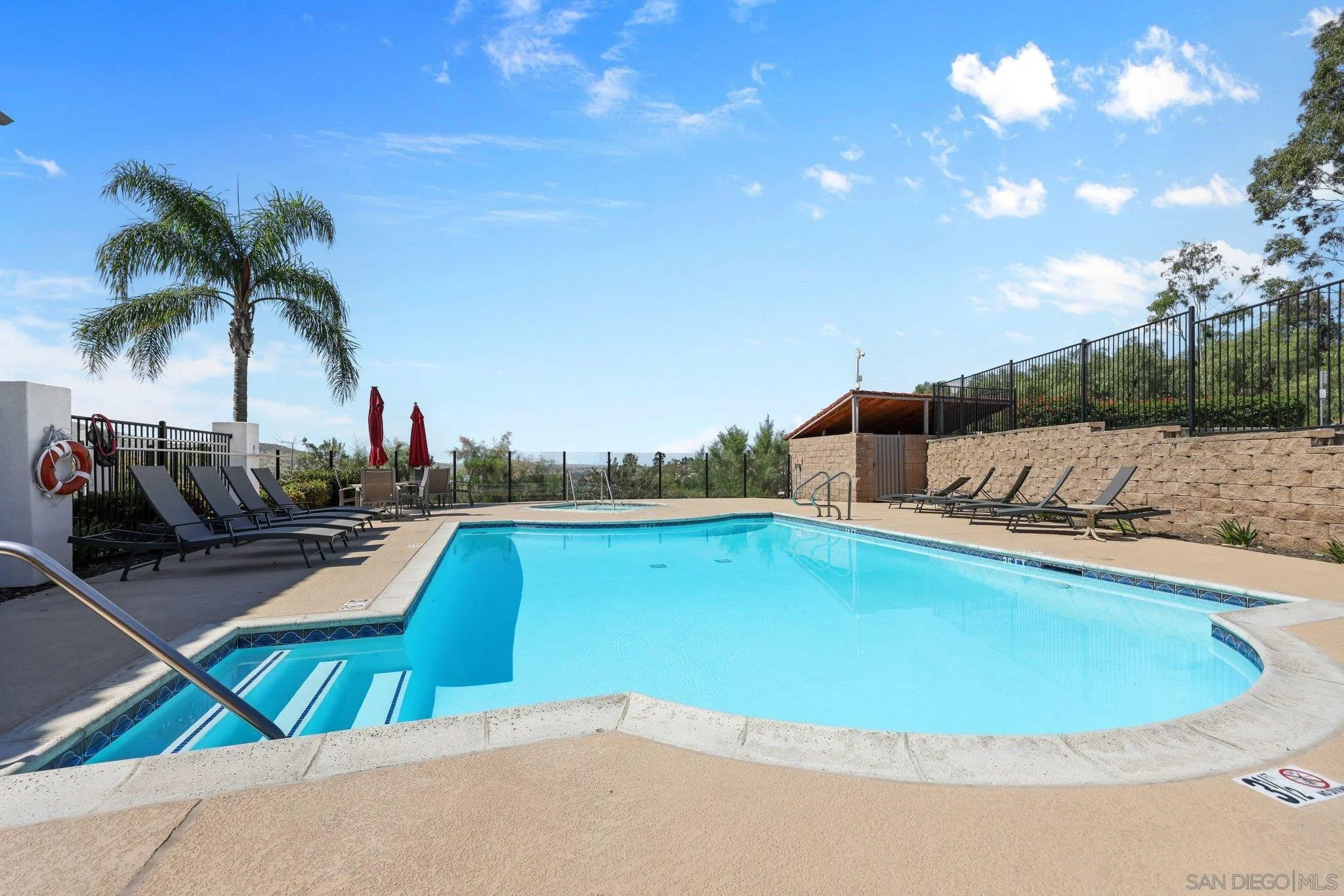2708 Lake Pointe Drive, Unit 209 Spring Valley, CA 91977 - Photo 6 of 59 a view of a swimming pool and lounge chairs