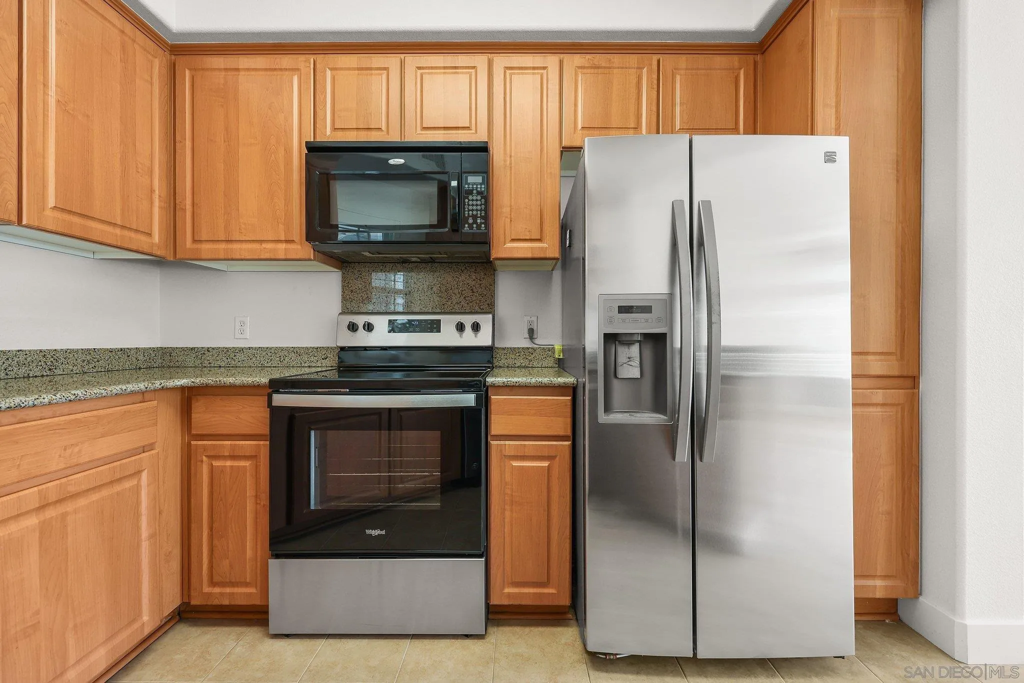2708 Lake Pointe Drive, Unit 209 Spring Valley, CA 91977 - Photo 9 of 59 a kitchen with stainless steel appliances granite countertop a refrigerator and a stove