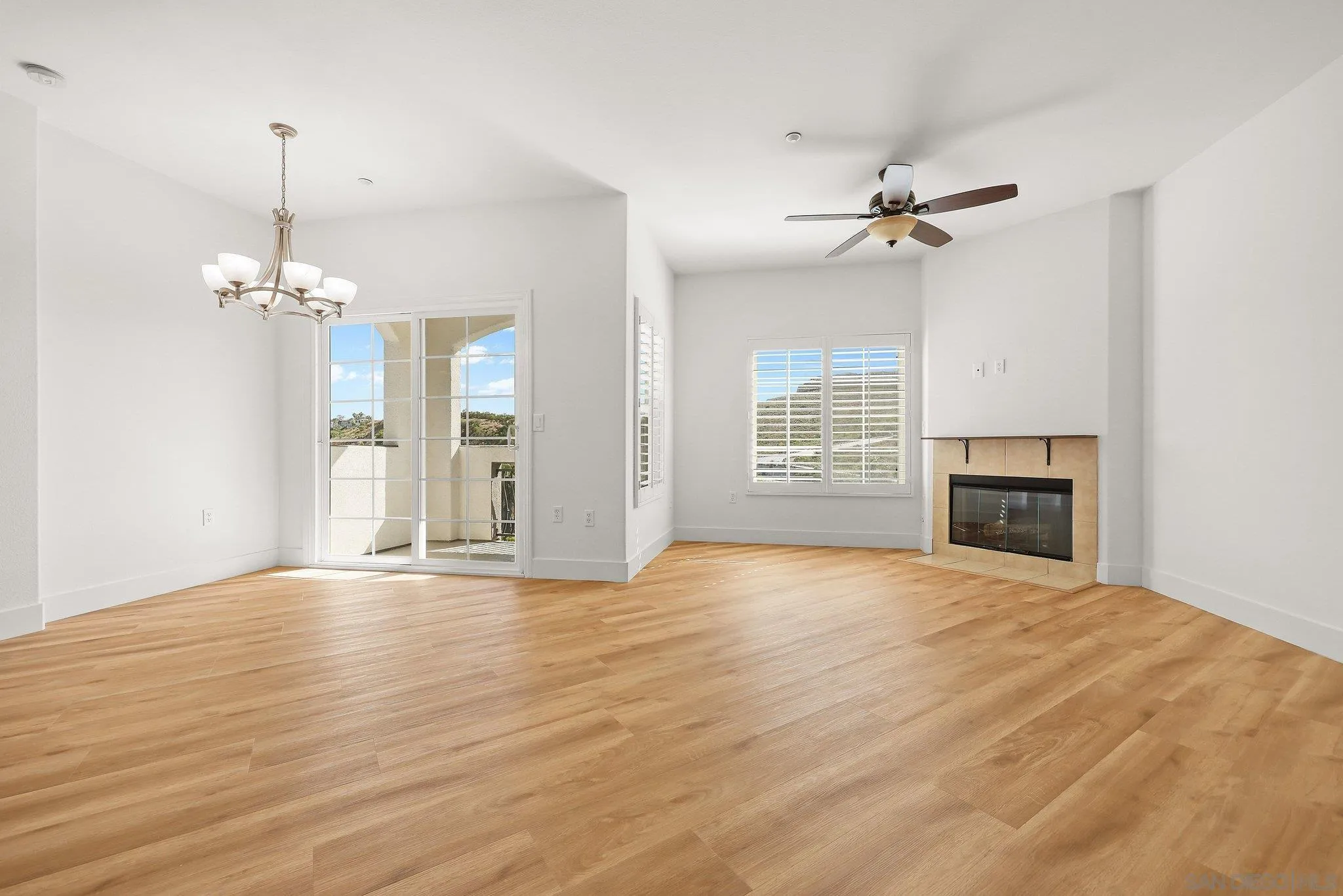 2708 Lake Pointe Drive, Unit 209 Spring Valley, CA 91977 - Photo 10 of 59 a view of empty room with wooden floor and fan