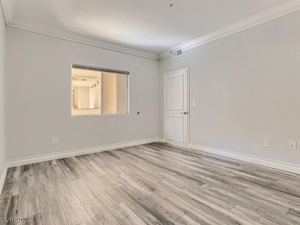 260 East Flamingo Road, Unit 220 Las Vegas, NV 89169 - Photo 16 of 32 Newly installed hardwood flooring and fresh paint create a crisp, inviting atmosphere.