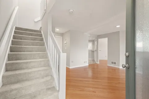 a view of an empty room with stairs