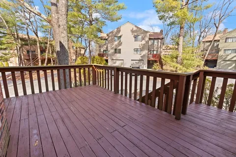 a view of balcony with wooden floor
