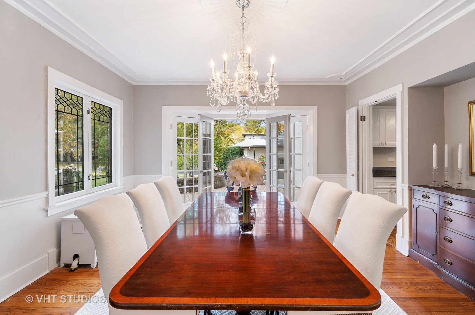 304 Cumnor Road Kenilworth, IL 60043 - Photo 13 of 40 a living room with furniture dining table and a chandelier