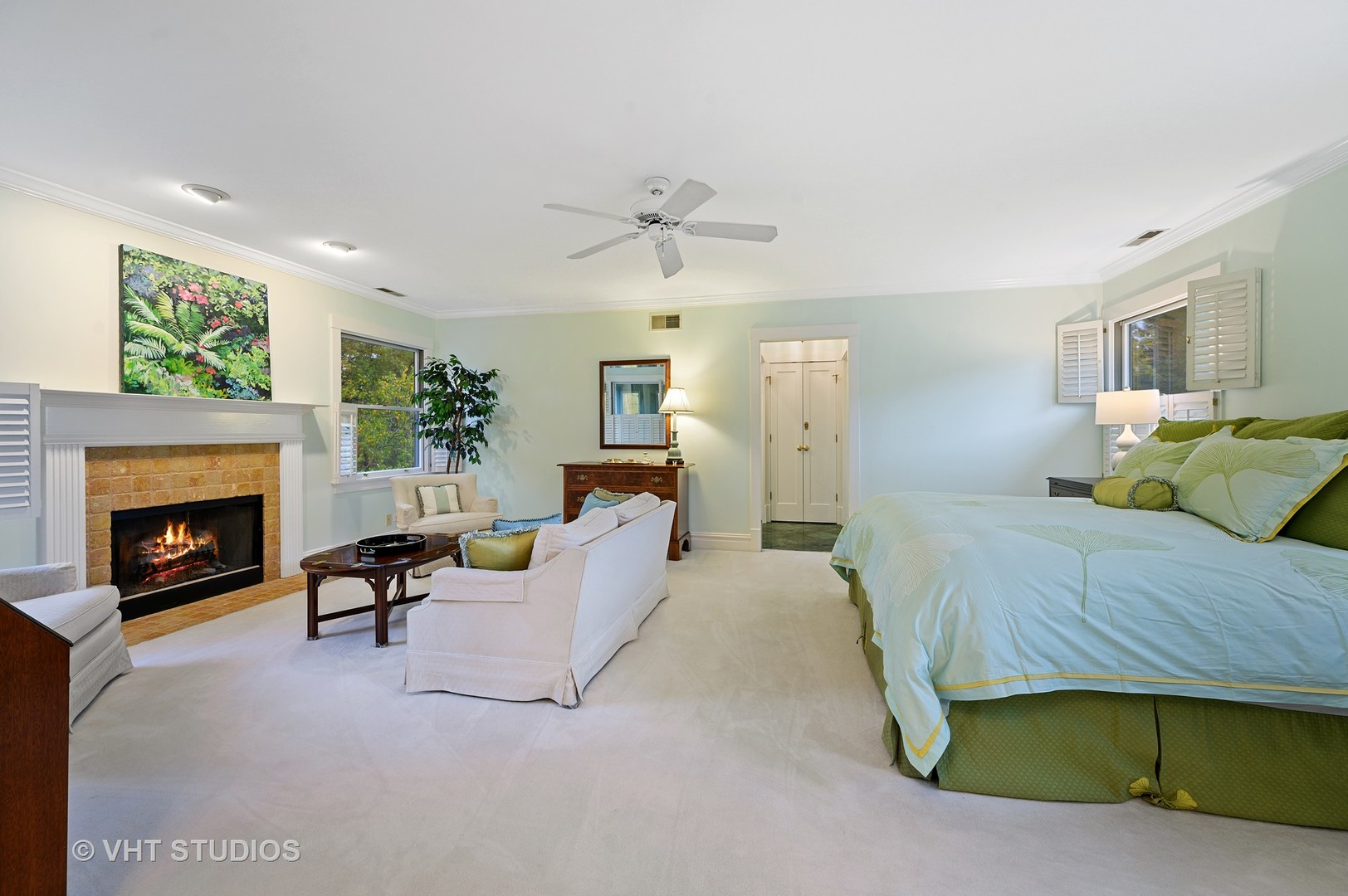 304 Cumnor Road Kenilworth, IL 60043 - Photo 22 of 40 a bedroom with a bed and a fireplace