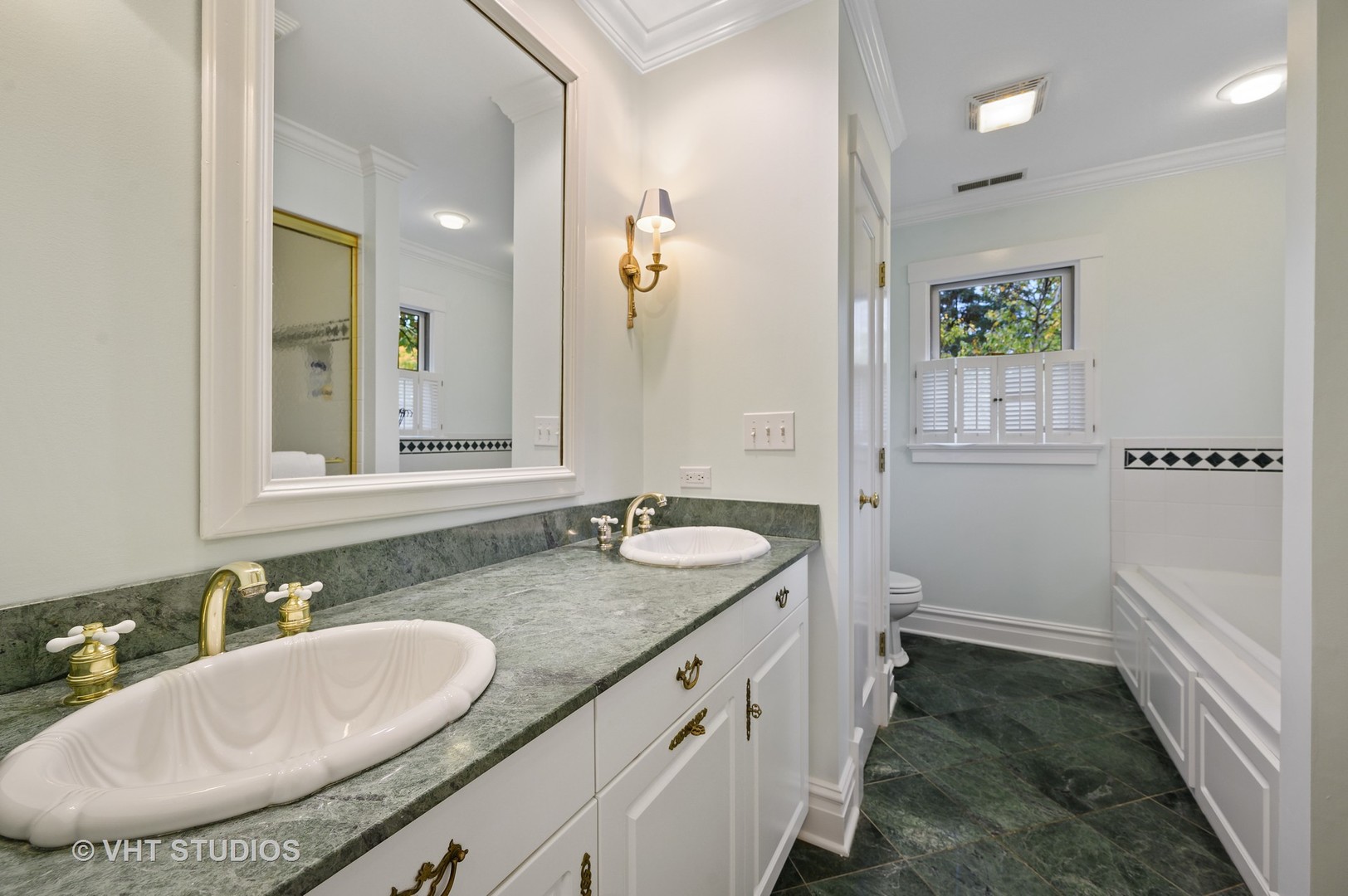 304 Cumnor Road Kenilworth, IL 60043 - Photo 25 of 40 a bathroom with a granite countertop sink and a mirror