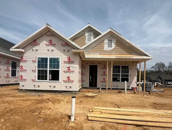 a view of a house with entrance gate
