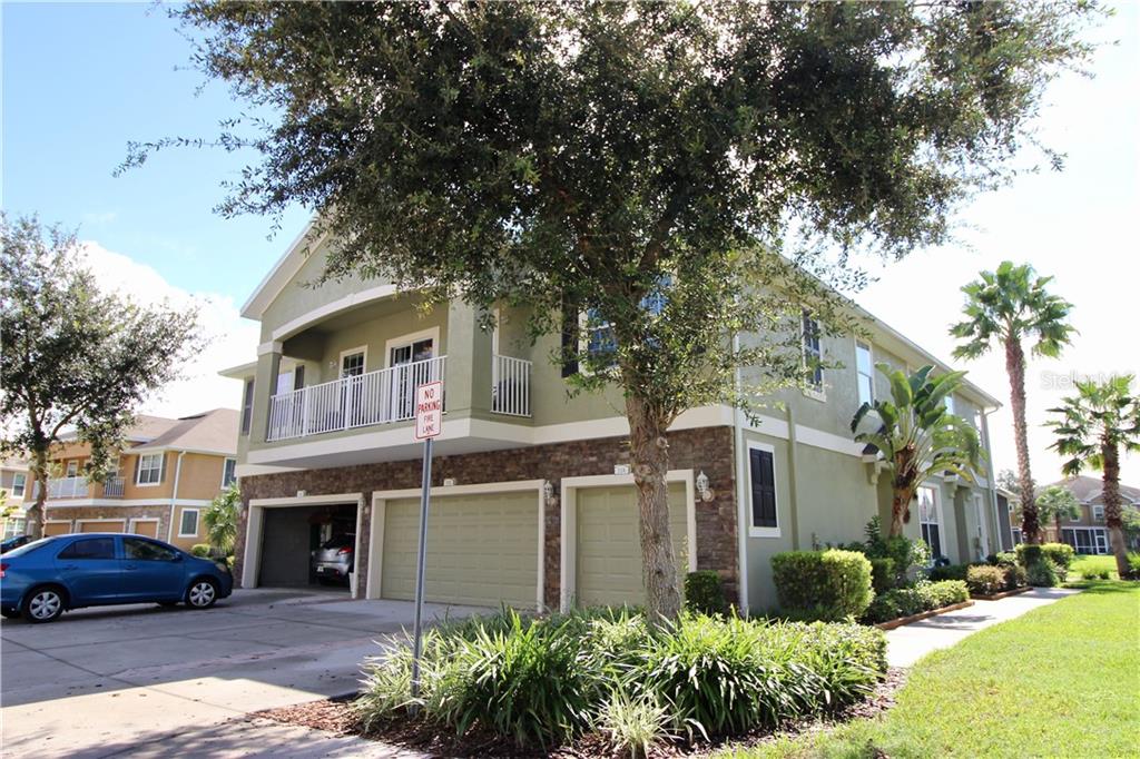 7001 Interbay Boulevard, Unit 304 Tampa, FL 33616 - Photo 1 of 1 a front view of a house with garden