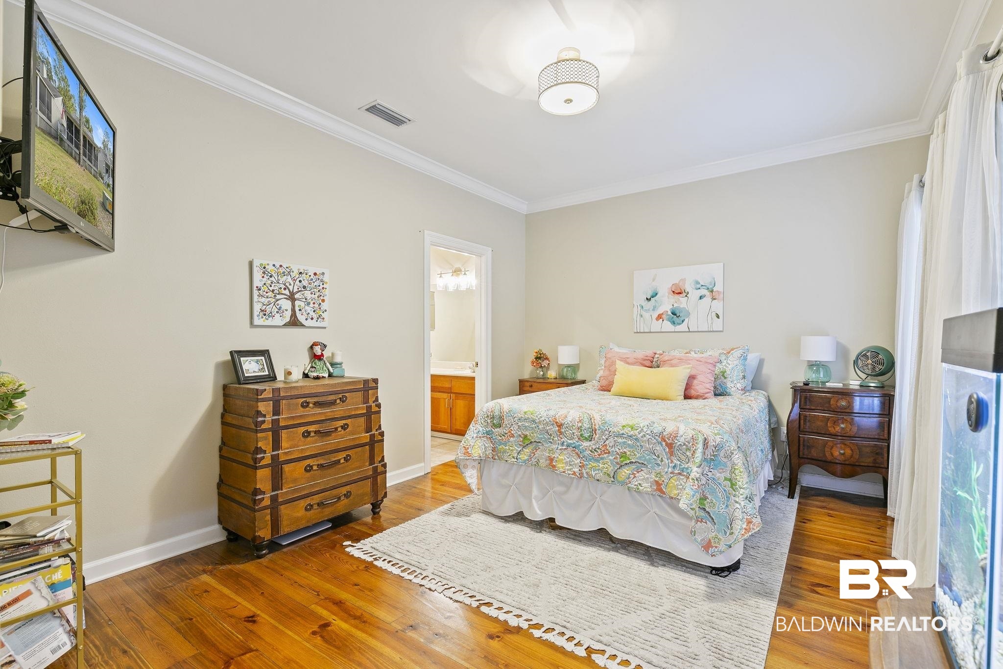17341 Cabin Road Loxley, AL 36551 - Photo 23 of 49 Bedroom featuring ensuite bath, hardwood / wood-style flooring, and crown molding