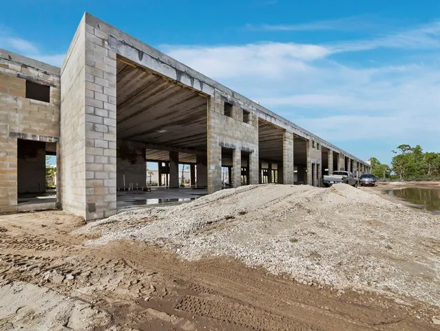 a view of a house with a snow in the background