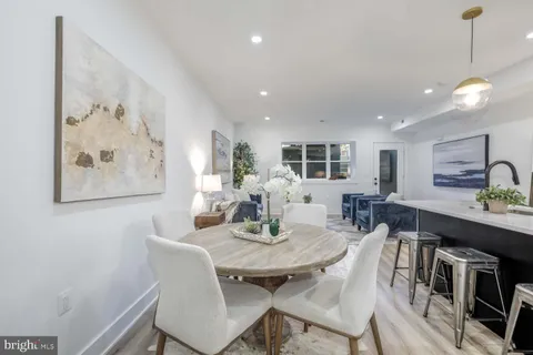 a kitchen with a sink cabinets and stainless steel appliances